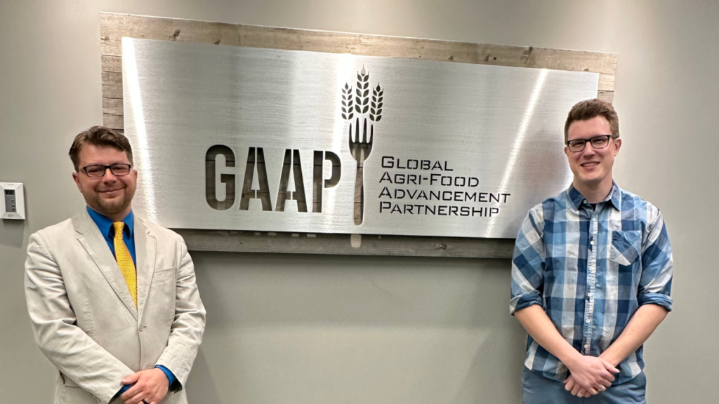 Zach Belak, CEO and co-Founder and Iain Wallace, CSO and Co-Founder standing infront of the GAAP sign